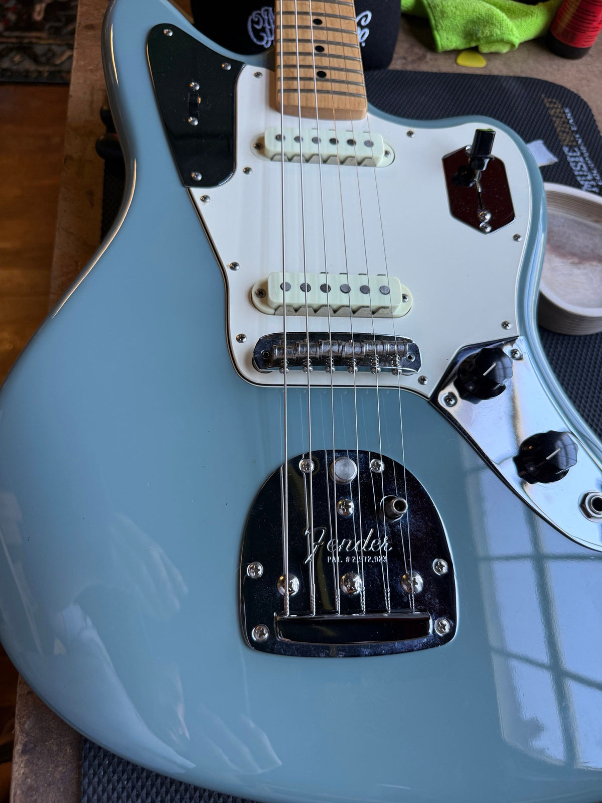 Light blue Fender American Jaguar on the repair bench