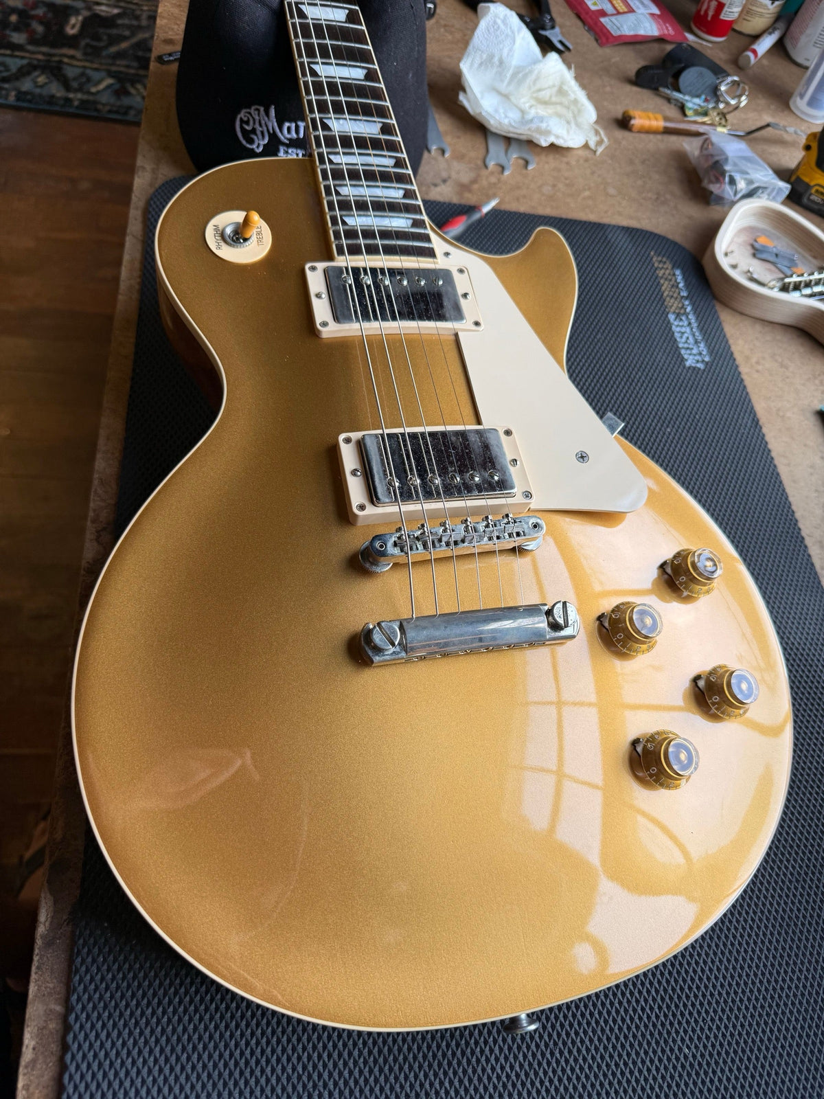 Gibson Les Paul gold top on the repair bench after a setup