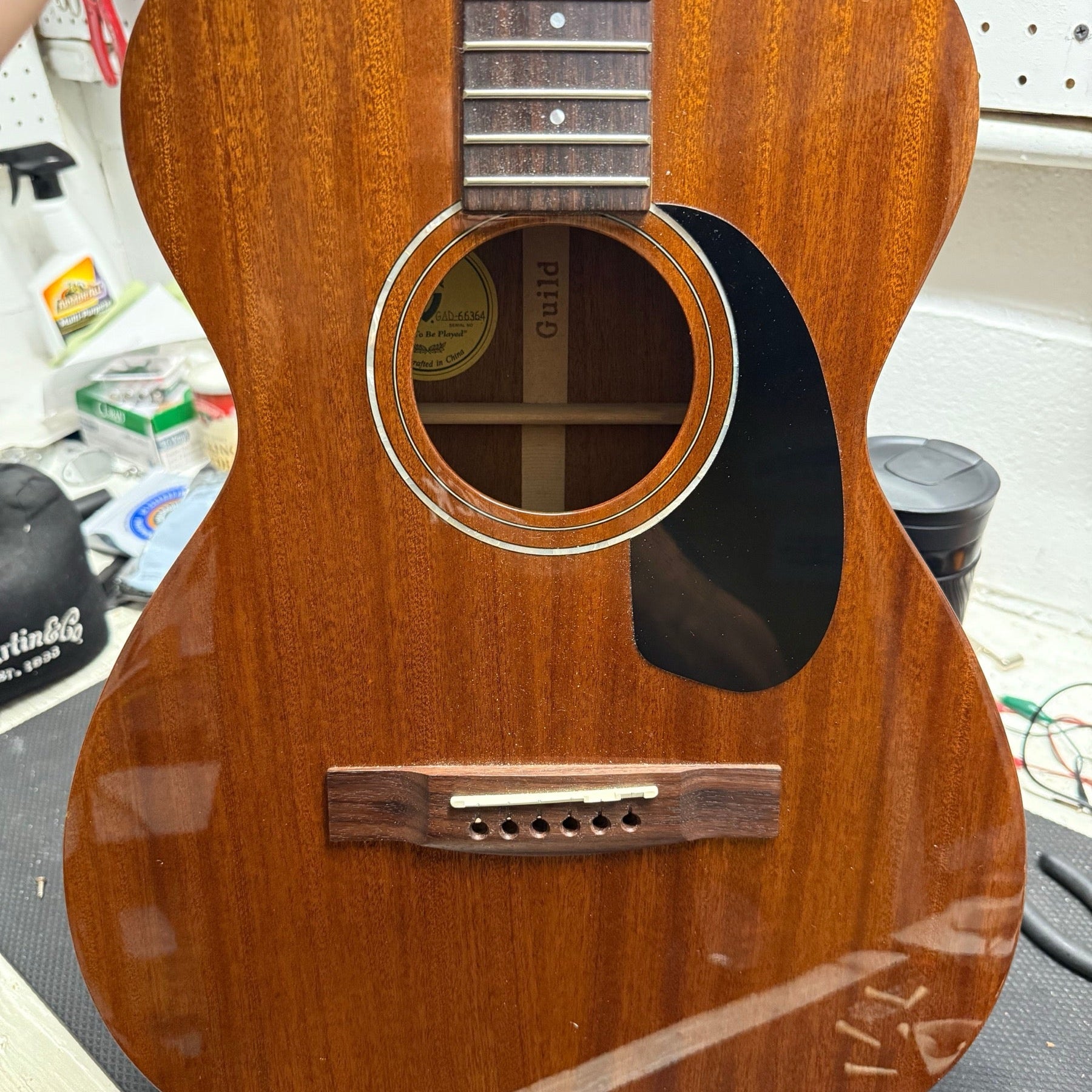 All-mahogany Guild acoustic guitar on the repair bench