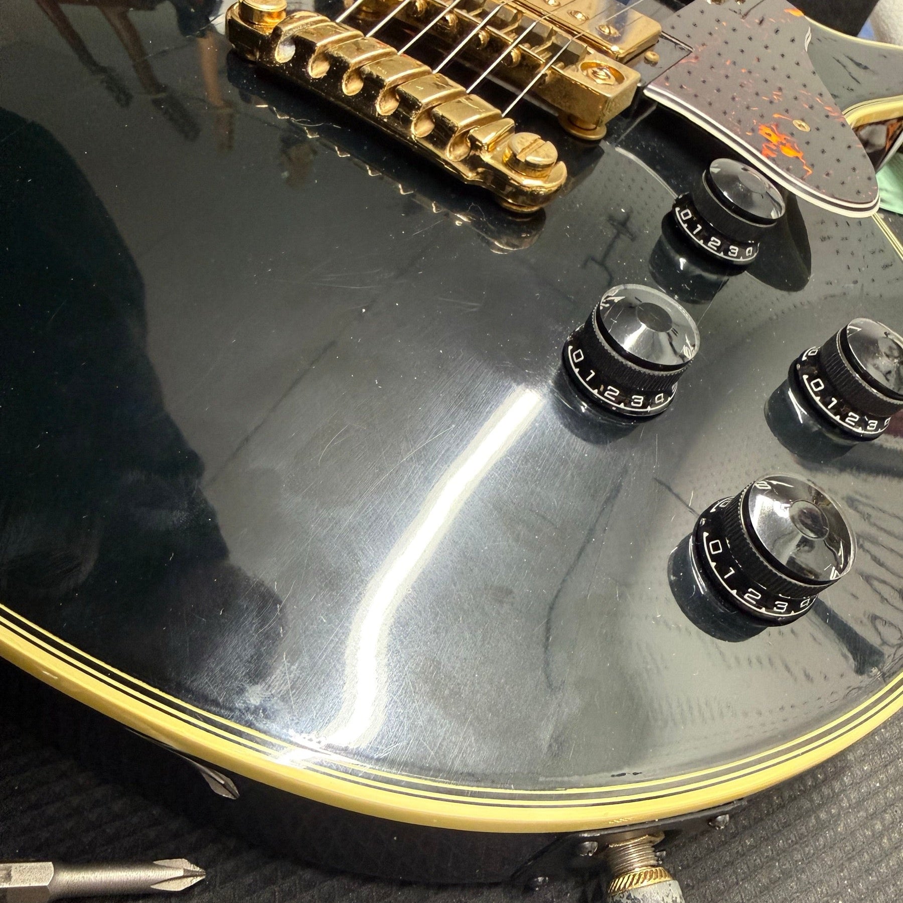 Ibanez PF200 electric guitar on the repair bench after a nut repair and setup