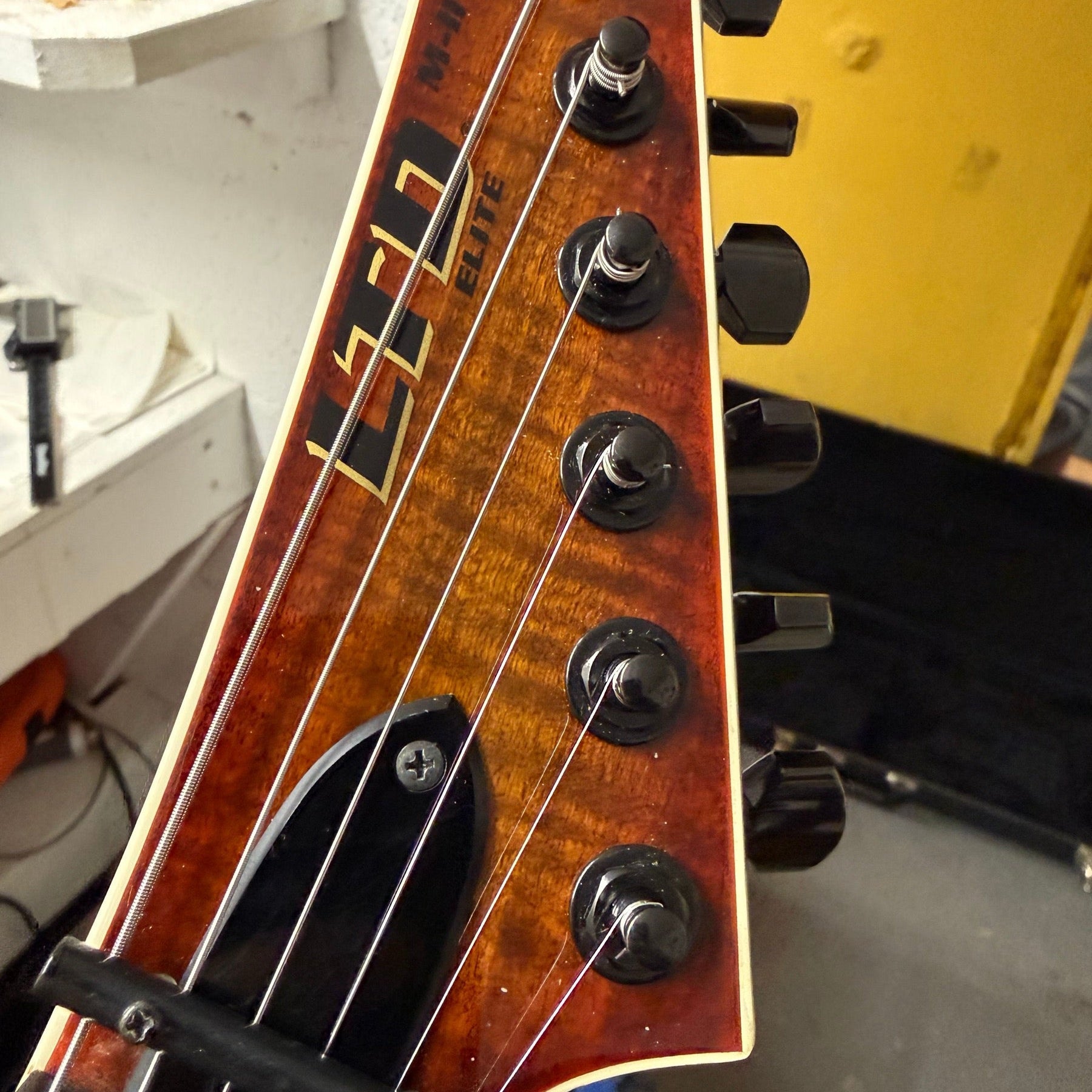 LTD electric guitar with a Floyd Rose tremolo on the repair bench