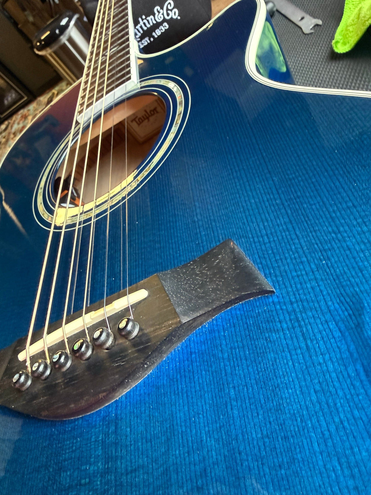 Blue Taylor 612ce acoustic-electric on the repair bench