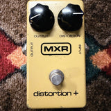 MXR Distortion+, yellow: top with the Output and Distortion knobs, the block MXR logo and the footswitch, no LED