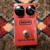 1975-1984 MXR MX-102 Block Logo Dyna Comp, red: top with the Output and Sensitivity knobs, the block MXR logo, dyna comp and the footswitch, no LED
