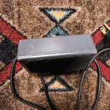 1976-1984 MXR MX-117 Flanger, gray: front edge below the footswitch, with the two-prong wall plug at the end of the cord