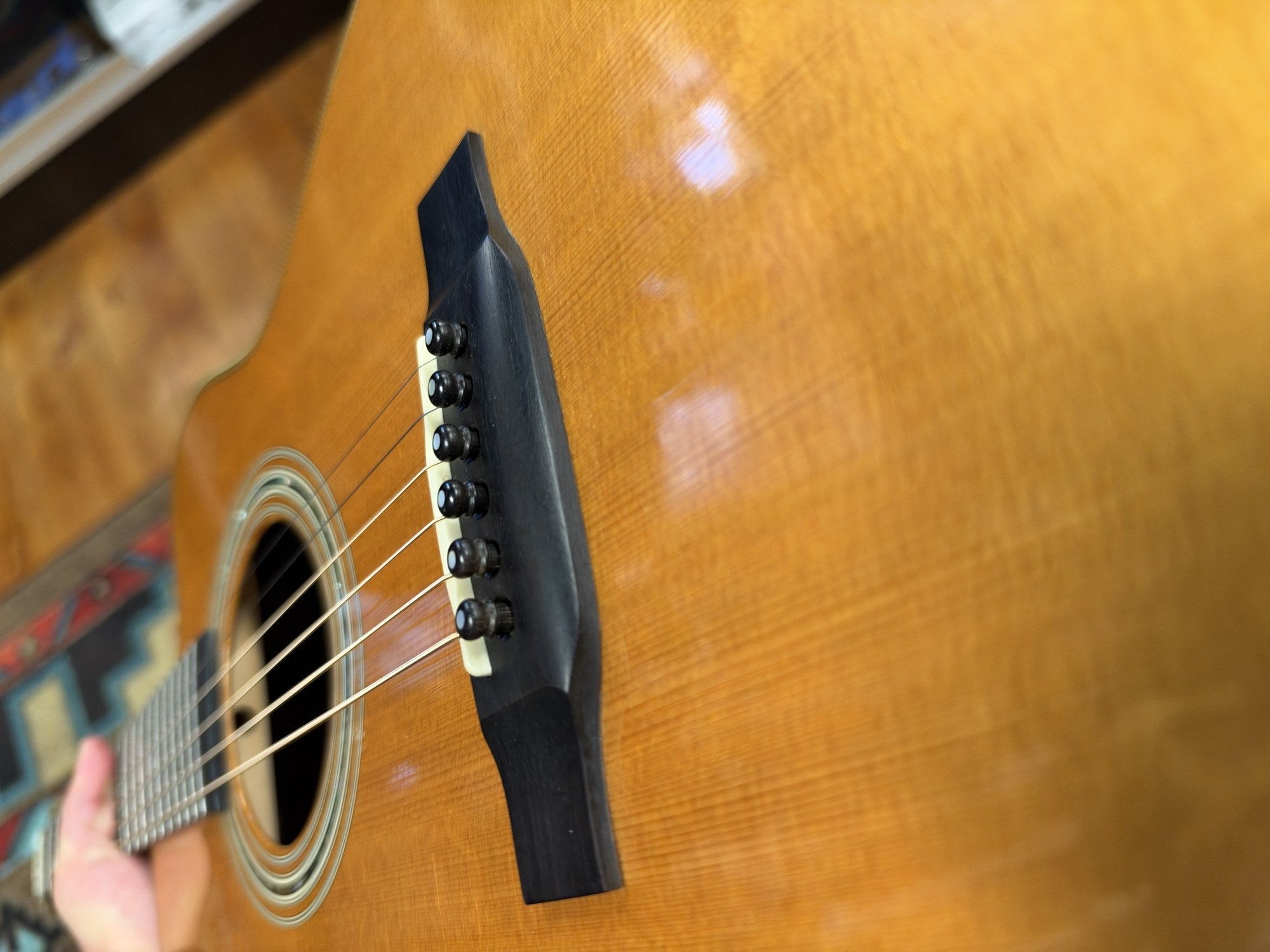 Martin 000C-28SMH Merle Haggard Blue Yodel No. 13, 2001: bridge and top at a low angle toward the soundhole