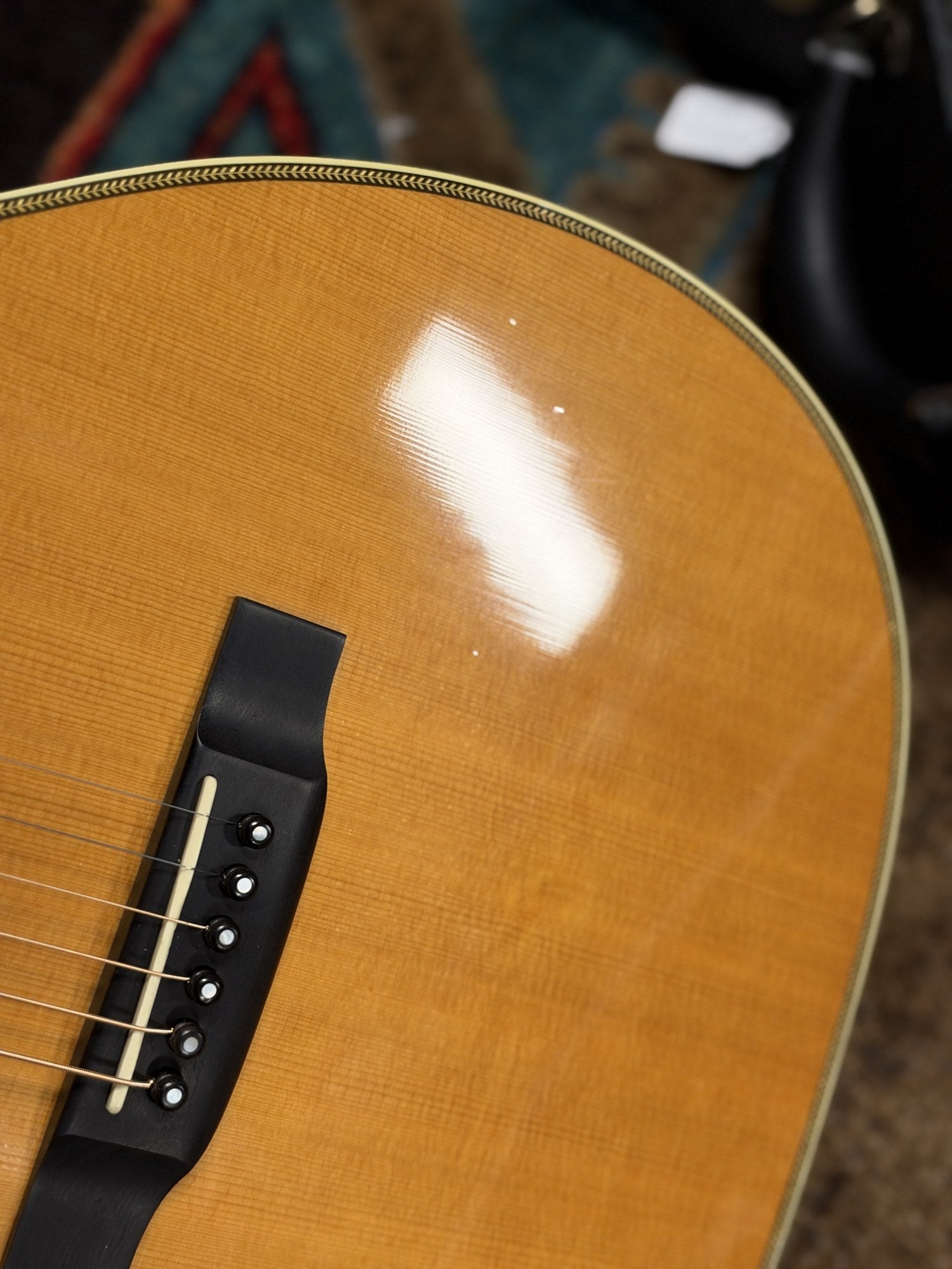 Martin 000C-28SMH Merle Haggard Blue Yodel No. 13, 2001: bass side of the lower bout and bridge in shop light