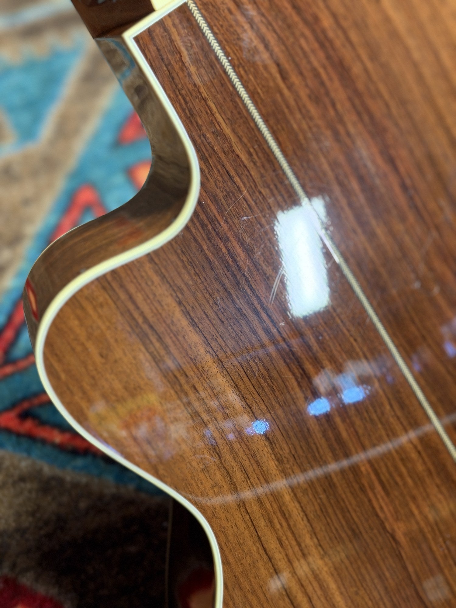 Martin 000C-28SMH Merle Haggard Blue Yodel No. 13, 2001: back at the cutaway with light surface marks visible