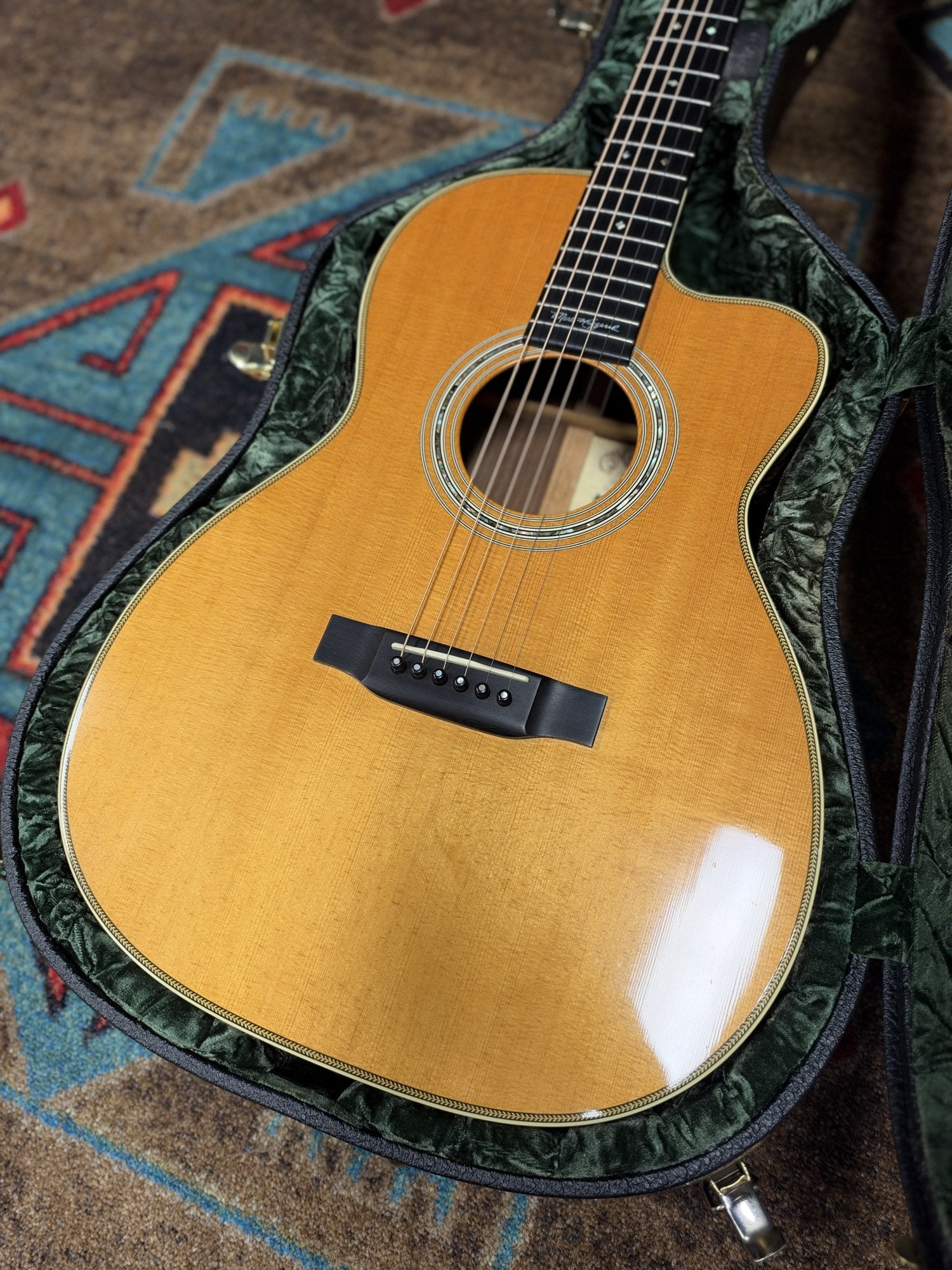 Martin 000C-28SMH Merle Haggard Blue Yodel No. 13, 2001: front of the Sitka spruce top in its hardshell case