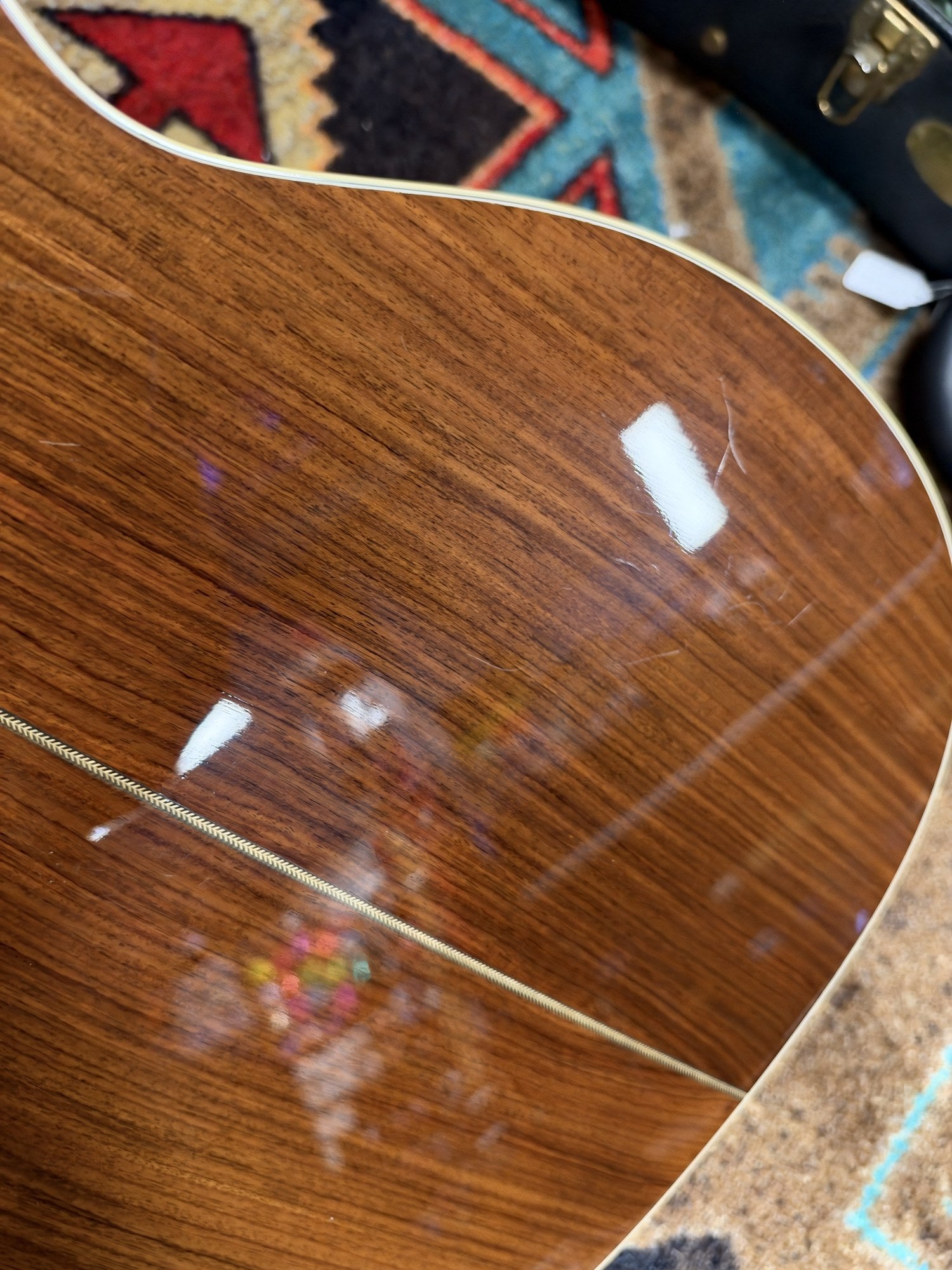 Martin 000C-28SMH Merle Haggard Blue Yodel No. 13, 2001: lower bout of the back, light surface marks near the edge