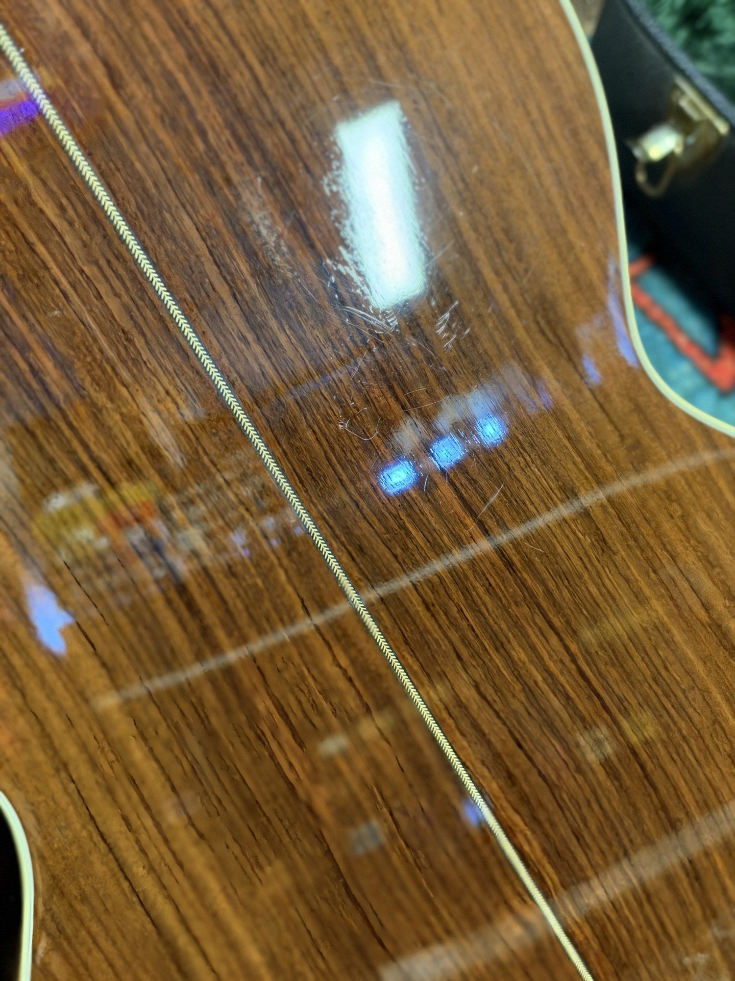 Martin 000C-28SMH Merle Haggard Blue Yodel No. 13, 2001: back finish close up showing light scratches under glare