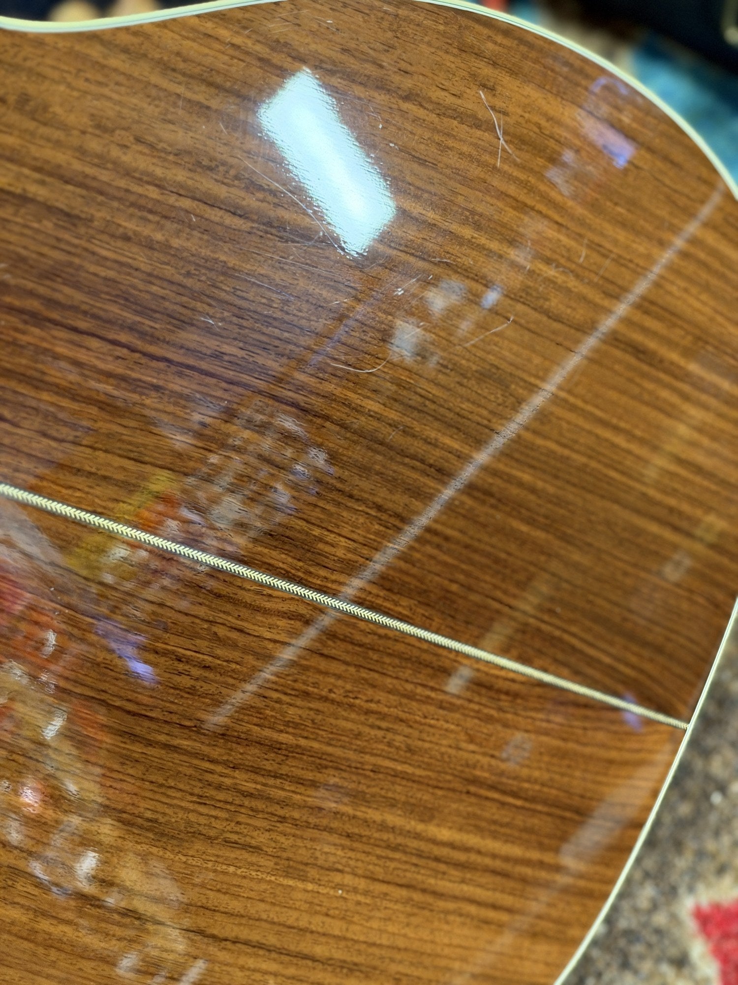 Martin 000C-28SMH Merle Haggard Blue Yodel No. 13, 2001: back finish close up, surface marks along the center strip