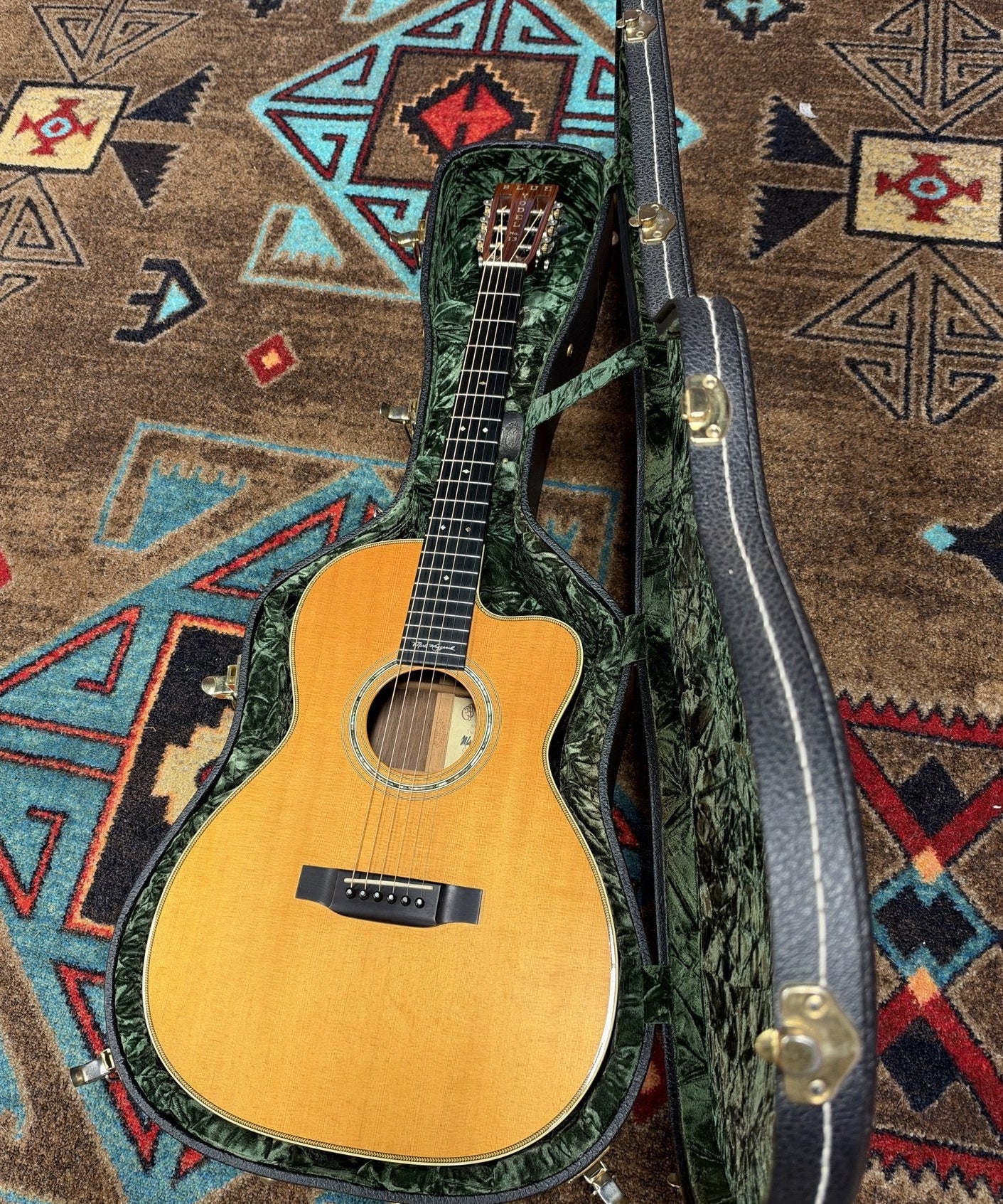 Martin 000C-28SMH Merle Haggard Blue Yodel No. 13, 2001: full guitar lying in its open green-lined hardshell case