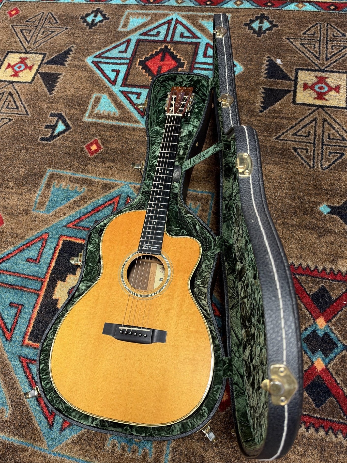 Martin 000C-28SMH Merle Haggard Blue Yodel No. 13, 2001: full guitar lying in its open green-lined hardshell case