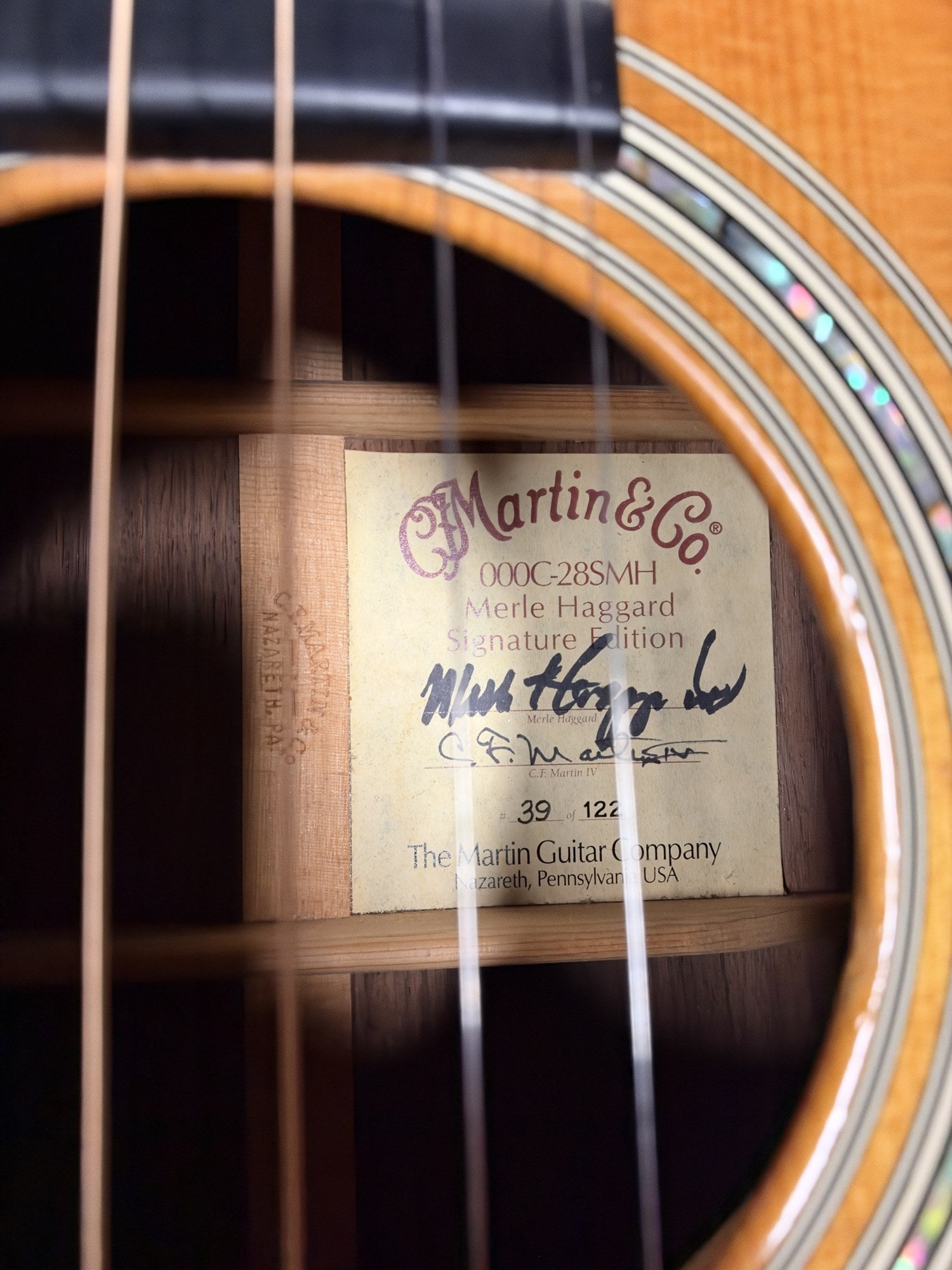 Martin 000C-28SMH Merle Haggard Blue Yodel No. 13, 2001: factory label signed by Merle Haggard and C.F. Martin IV, number 39 of 122
