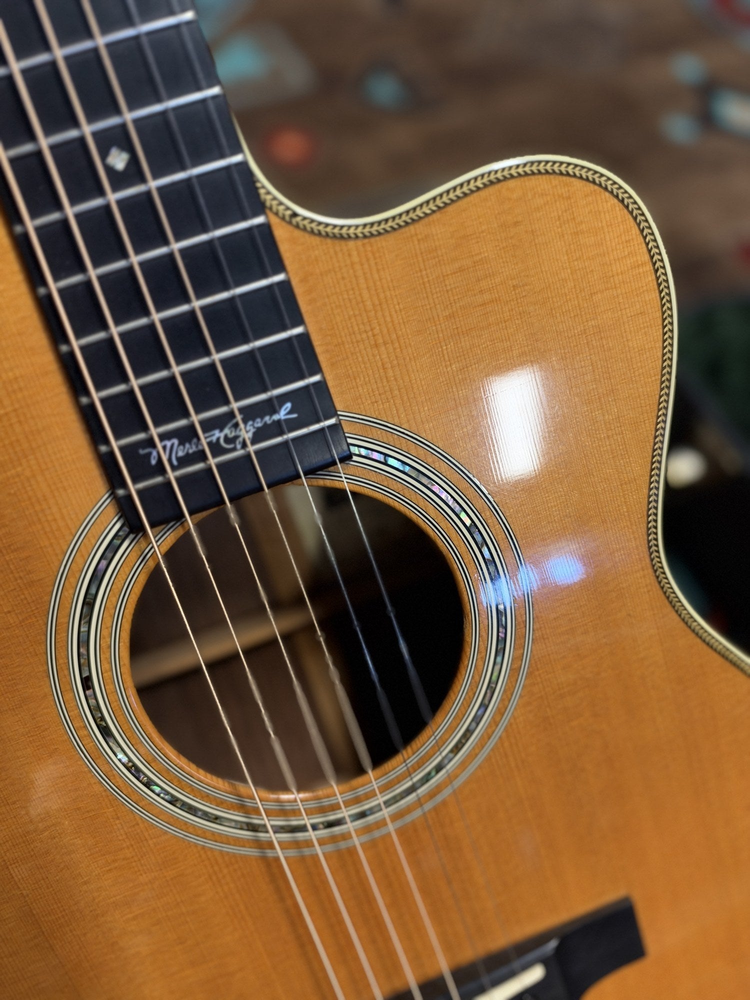 Martin 000C-28SMH Merle Haggard Blue Yodel No. 13, 2001: cutaway, abalone rosette and signature inlay from the treble side