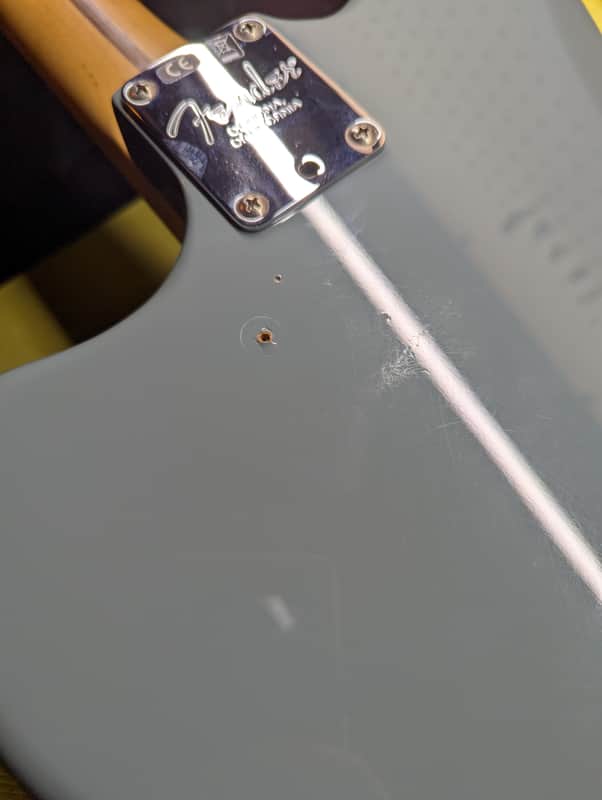 2017-2019 Fender American Professional Jaguar - neck plate close-up with body wear - Pauls Guitar Hideout