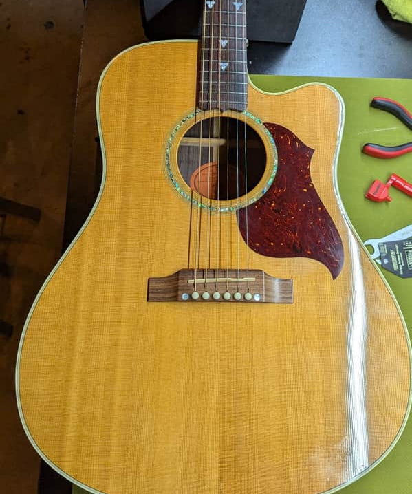 1999 Gibson Songbird Deluxe - body front soundhole and pickguard - Pauls Guitar Hideout