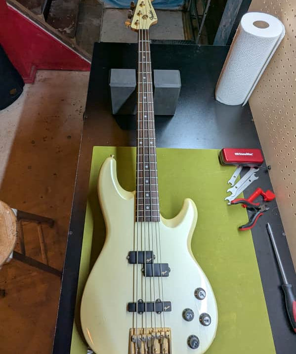 1989 Fender Precision Bass Lyte MIJ - front full body on workbench - Pauls Guitar Hideout