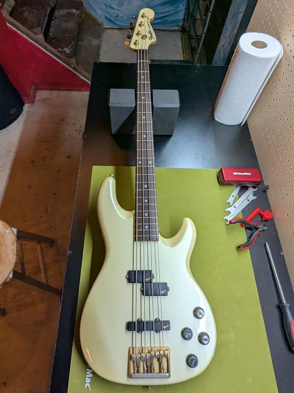 1989 Fender Precision Bass Lyte MIJ - front full body on workbench - Pauls Guitar Hideout