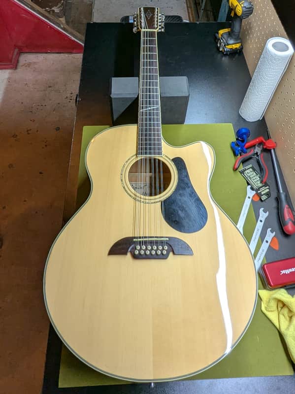 Alvarez AJ-60SC/12 - front full body 12-string on workbench - Pauls Guitar Hideout