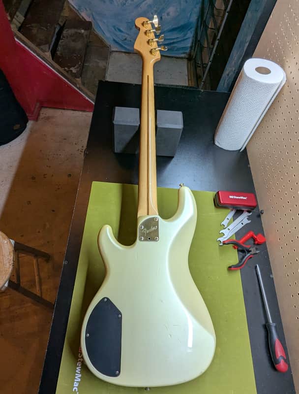 1989 Fender Precision Bass Lyte MIJ - back full body on workbench - Pauls Guitar Hideout