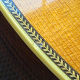 Martin 000C-28SMH Merle Haggard Blue Yodel No. 13, 2001: top edge close up, herringbone purfling and cream binding over the rosewood side, fine checking in the top's finish