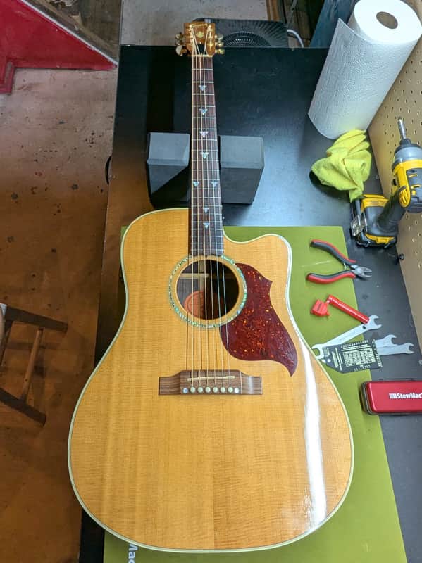 1999 Gibson Songbird Deluxe - front full body on workbench - Pauls Guitar Hideout
