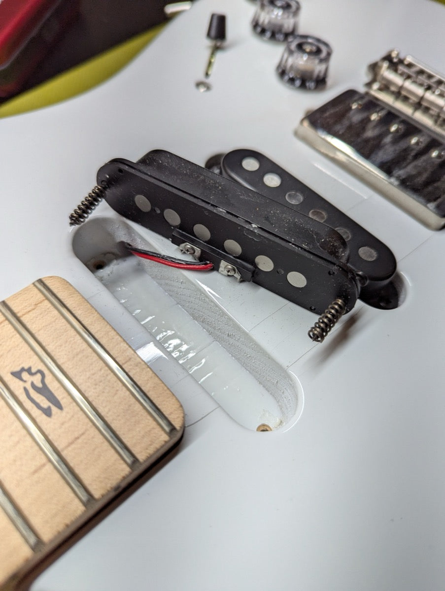 PRS Fiore Mark Lettieri Signature in Sugar Moon — single-coil pickups removed, control cavity exposed, neck heel and Fiore signature trem cover visible — Paul's Guitar Hideout, Glens Falls NY