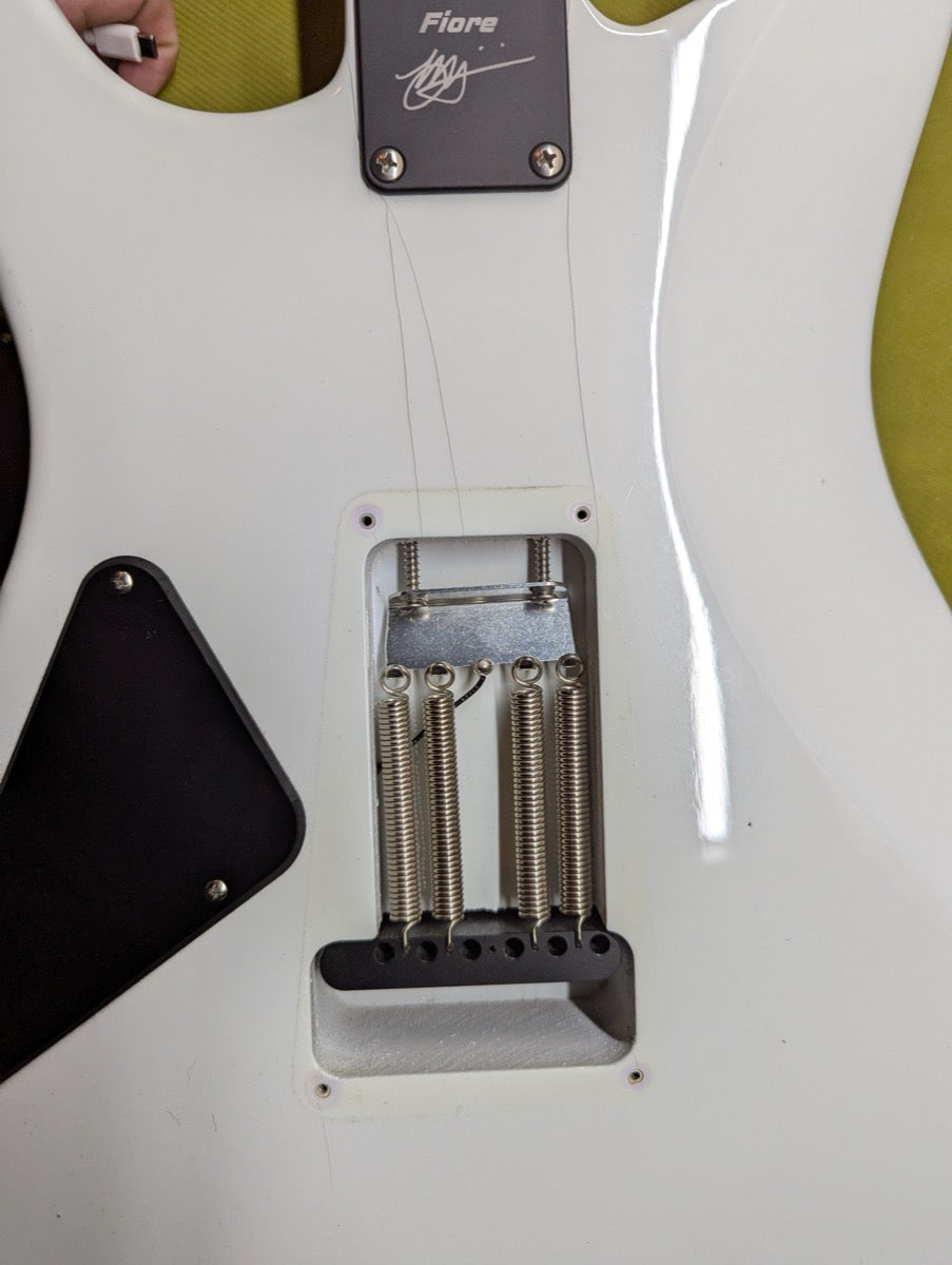 PRS Fiore Mark Lettieri — back of body showing trem spring claw with Fiore branding and Mark Lettieri signature plate — Paul's Guitar Hideout, Glens Falls NY