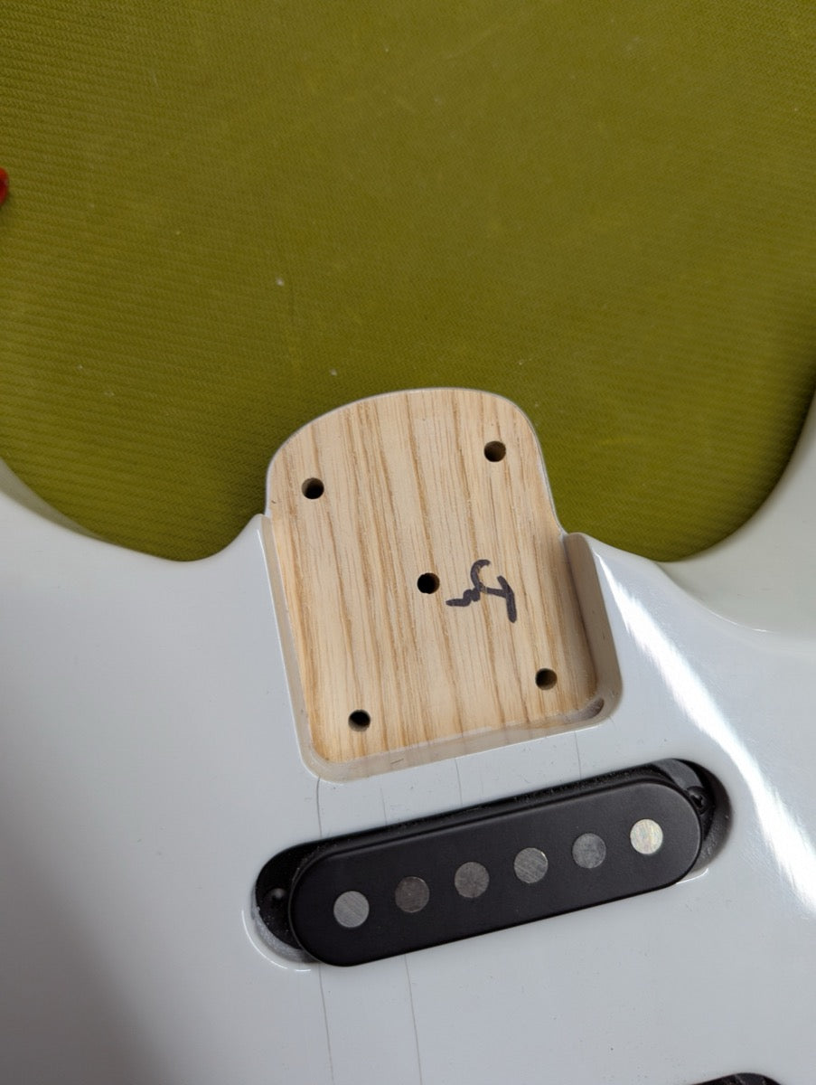 PRS Fiore Mark Lettieri — neck pocket detail showing swamp ash body wood and Fender F stamp — Paul's Guitar Hideout, Glens Falls NY