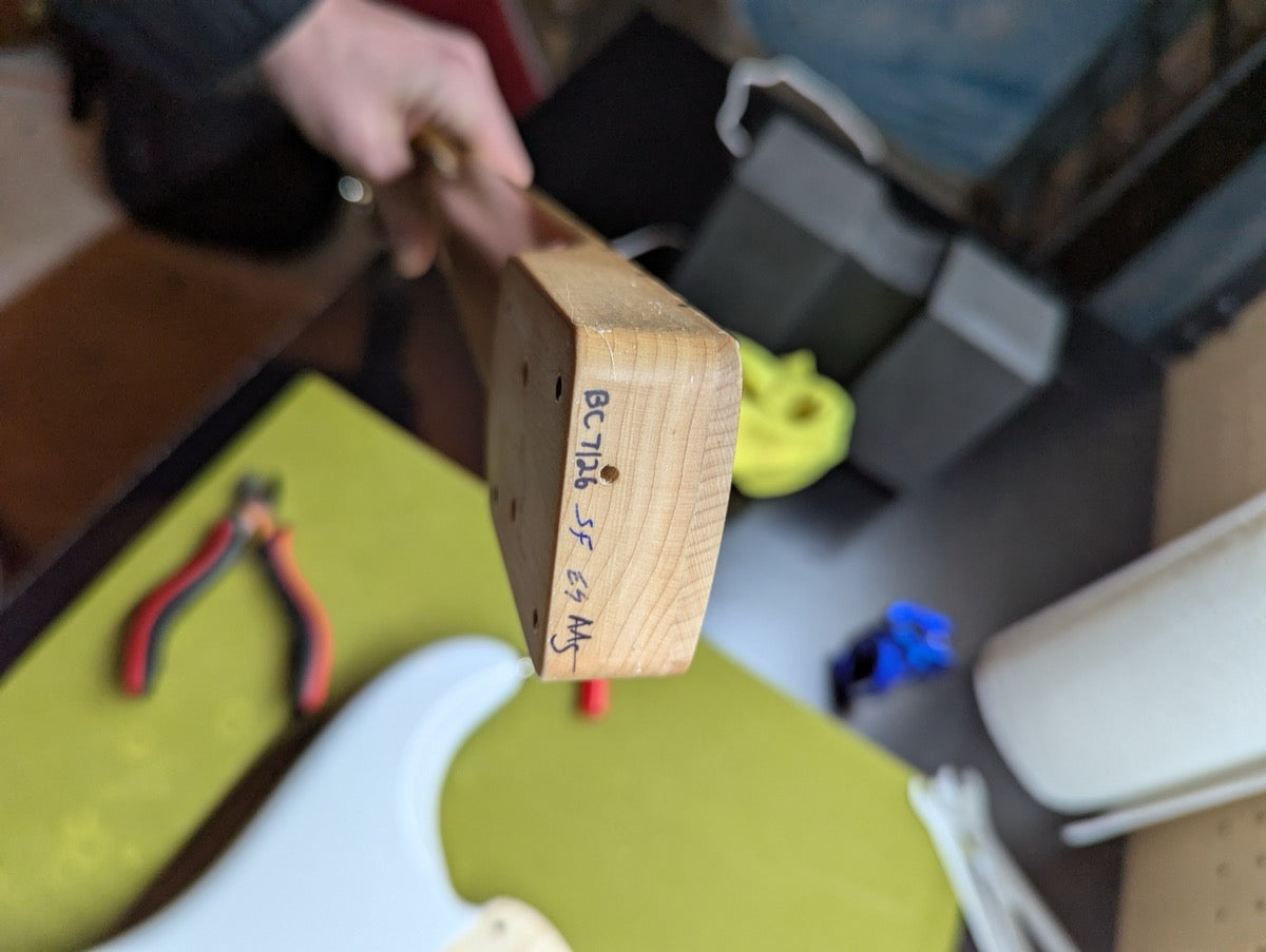 PRS Fiore Mark Lettieri — neck heel stamp with bench tracking marks visible — Paul's Guitar Hideout, Glens Falls NY