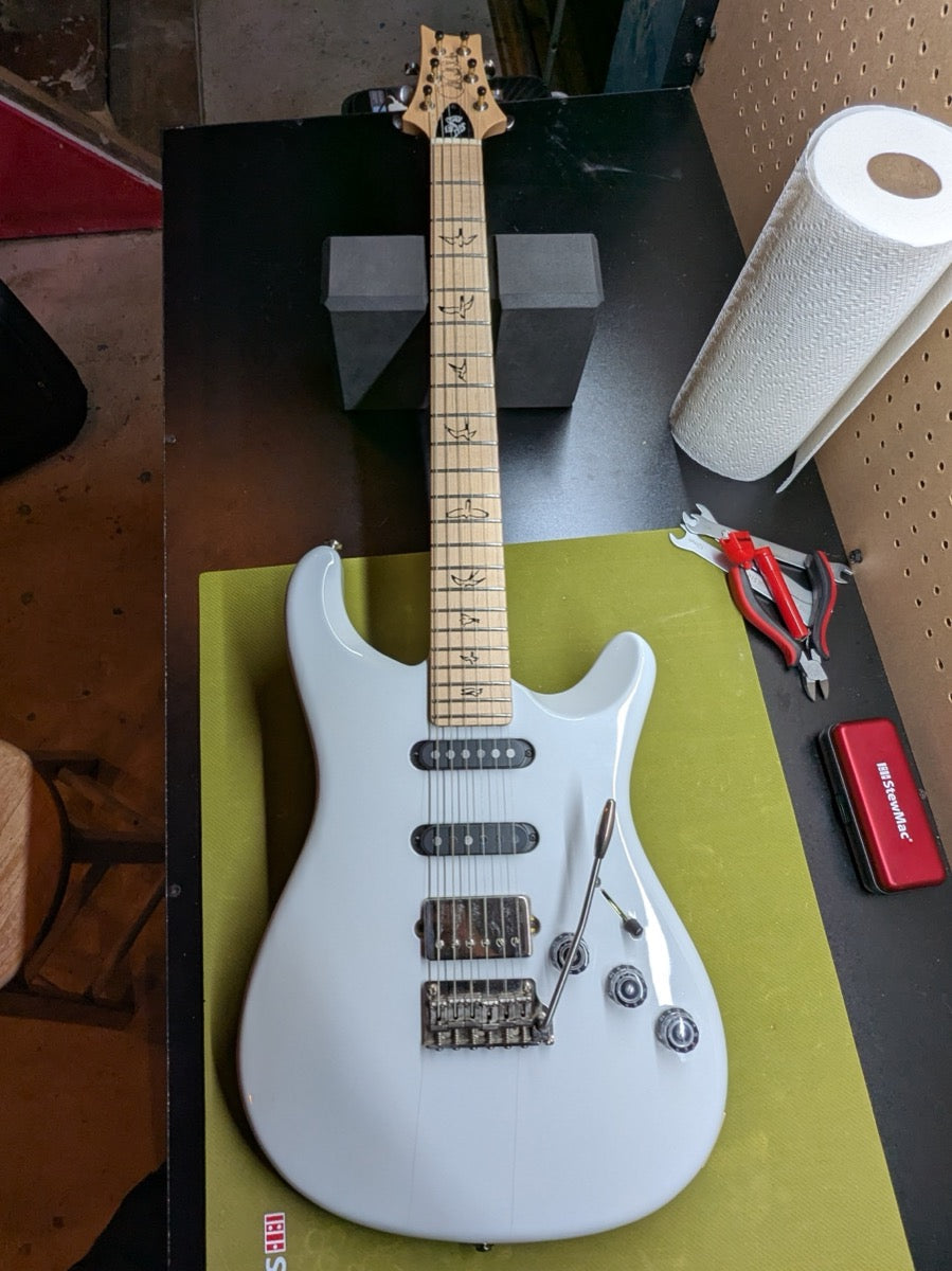 PRS Fiore Mark Lettieri Signature — full front shot on bench with maple fretboard and PRS bird inlays visible — Paul's Guitar Hideout, Glens Falls NY