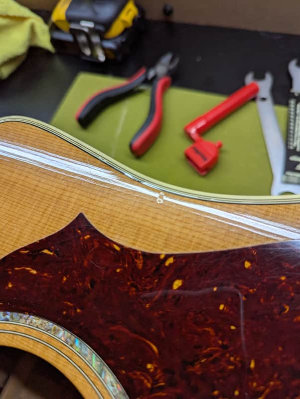 1999 Gibson Songbird Deluxe - binding and pickguard edge detail - Pauls Guitar Hideout