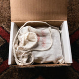 Analogman King of Tone V4, purple: the open box with the cloth drawstring bag inside