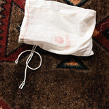 Analogman King of Tone V4, purple: the white cloth drawstring bag with the Analogman logo