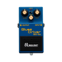 Boss BD-2W Waza Craft Blues Driver, blue enclosure, top view showing Level, Tone and Gain knobs and the Standard/Custom mode toggle
