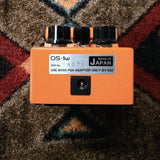 Boss DS-1W Waza Craft Distortion, orange: back end with the power jack and the DS-1w label, serial number 18071 and Made in Japan
