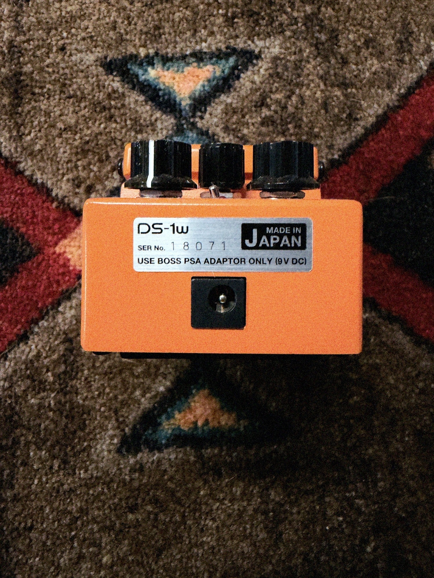 Boss DS-1W Waza Craft Distortion, orange: back end with the power jack and the DS-1w label, serial number 18071 and Made in Japan