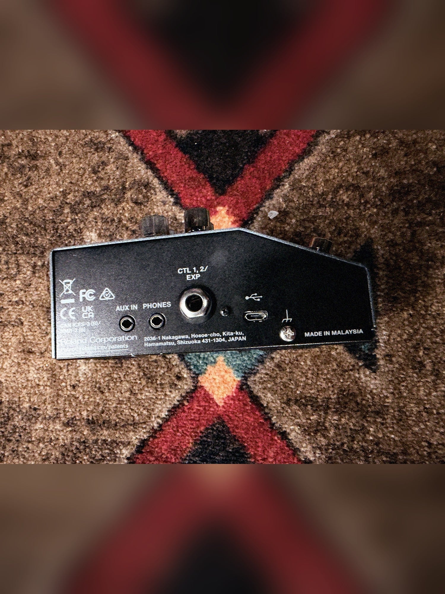 Boss IR-200 Amp & IR Cabinet, dark gray: left side with the Aux In, Phones, CTL 1,2/EXP and USB jacks and the Made in Malaysia print