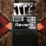 Boss RV-6 Reverb, dark gray: top with the E.Level, Tone, Time and Mode knobs, the input and output labels and the footswitch