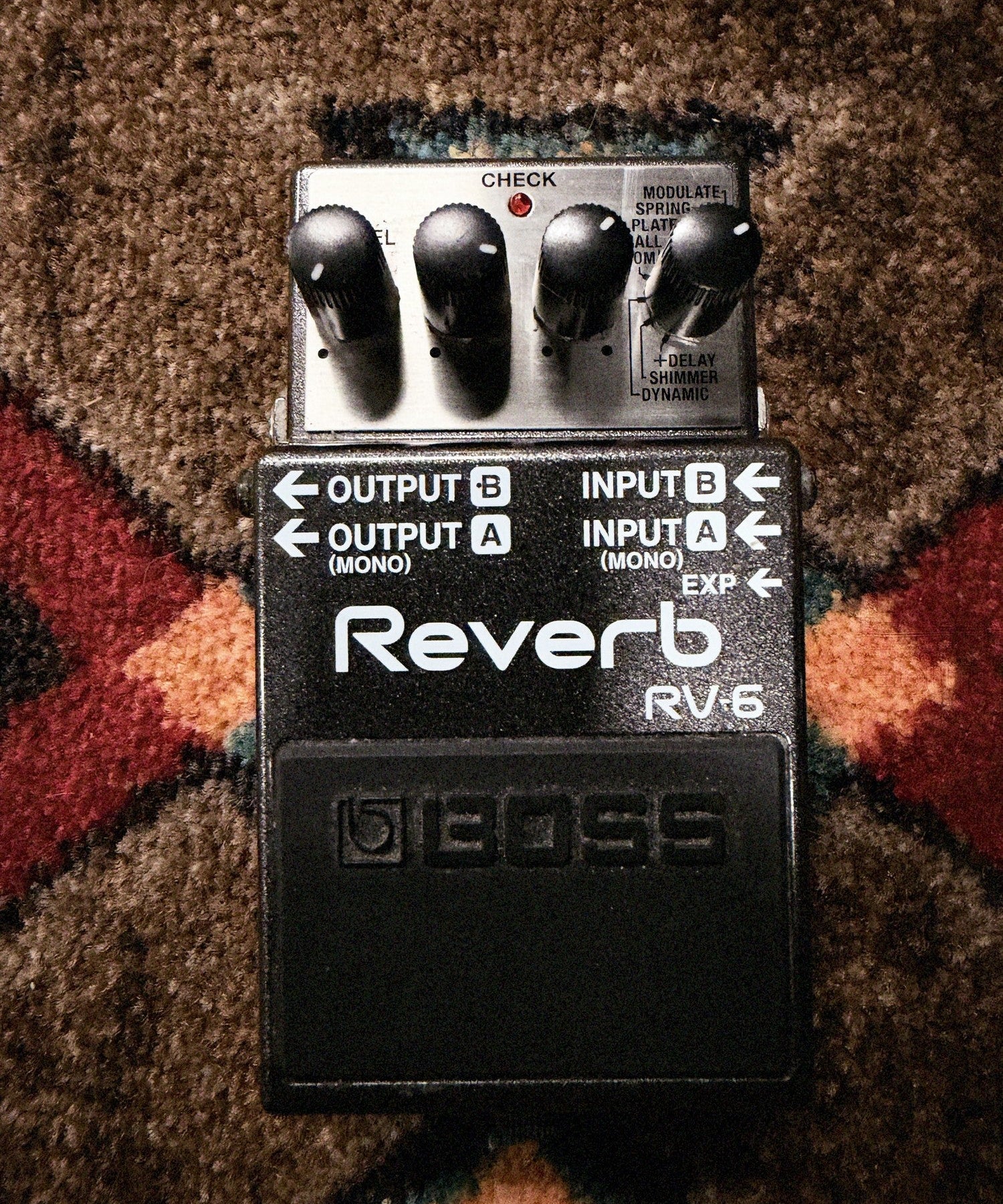 Boss RV-6 Reverb, dark gray: top with the E.Level, Tone, Time and Mode knobs, the input and output labels and the footswitch