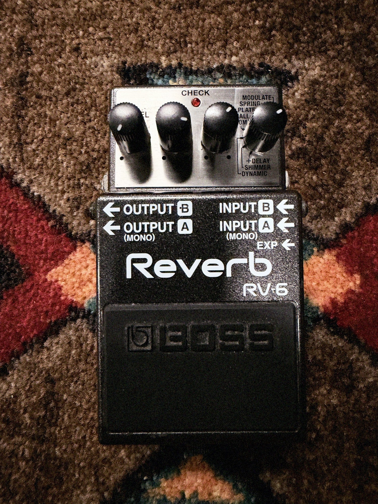 Boss RV-6 Reverb, dark gray: top with the E.Level, Tone, Time and Mode knobs, the input and output labels and the footswitch