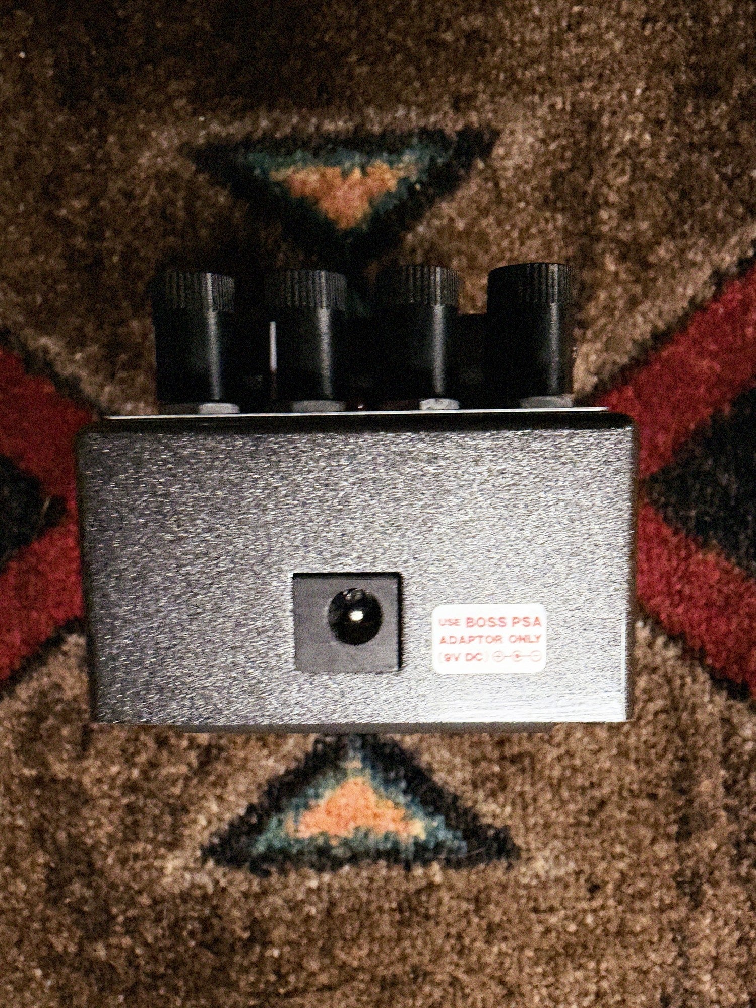 Boss RV-6 Reverb, dark gray: back end with the power jack and the Boss PSA adapter sticker