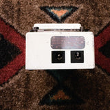 Boss TU-2 Chromatic Tuner, white: back end with the DC 9V in and out jacks and a worn silver label