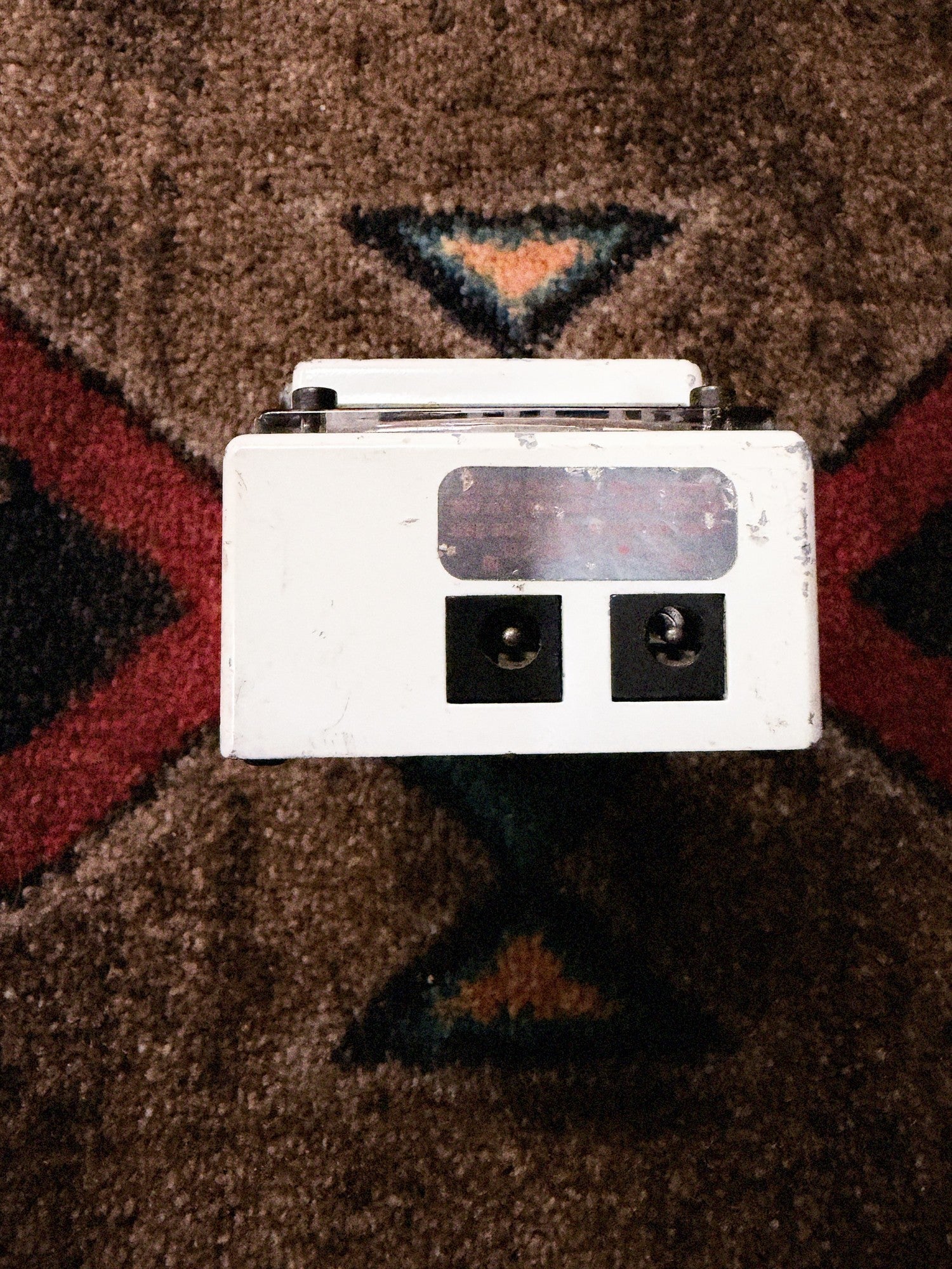Boss TU-2 Chromatic Tuner, white: back end with the DC 9V in and out jacks and a worn silver label