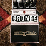 DigiTech Grunge, white crackle: top with the Loud, Low, High and Grunge knobs, the GRUNGE logo and the rubber-topped footswitch, the DigiTech print above the knobs worn