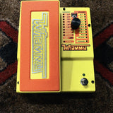 DigiTech MonoNeon Signature Whammy, neon orange and yellow: top with the treadle, the selector knob, the Classic/Chords switch and the footswitch