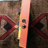 DigiTech MonoNeon Signature Whammy, neon orange and yellow: right side with the input and the 5-pin MIDI jack