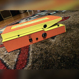 DigiTech MonoNeon Signature Whammy, neon orange and yellow: left side with the 9 volt power jack and the output